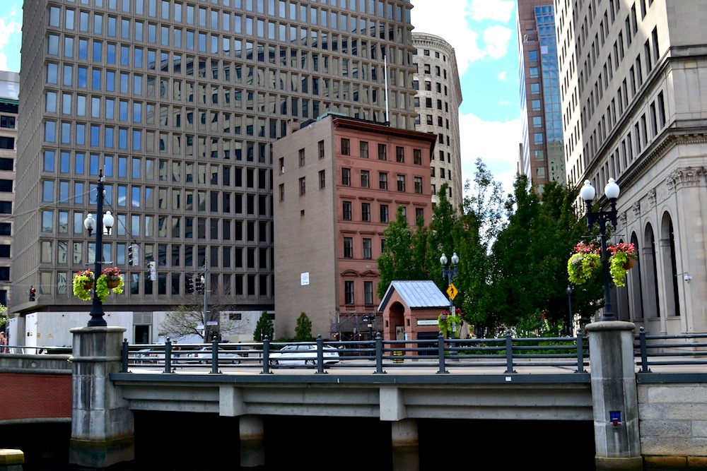 From a distance, the structure is dwarfed by newer buildings. 