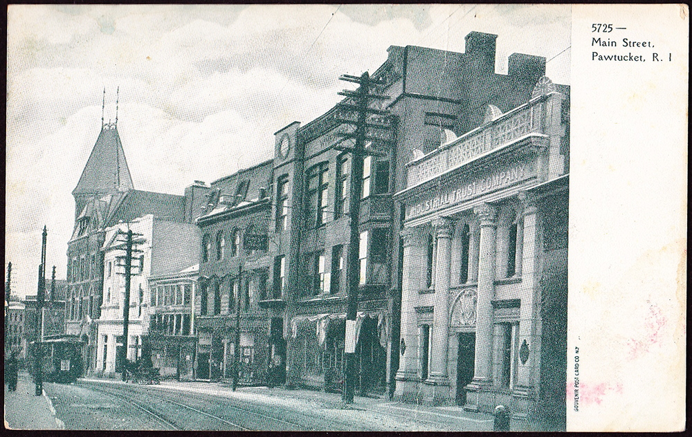 The First National Bank of Pawtucket and the Pacific National Bank were consolidated into a single branch representing the Industrial Trust Company in Pawtucket. Seen here at right, early 1900s, just down the street from Slater National Bank's headquarters. 