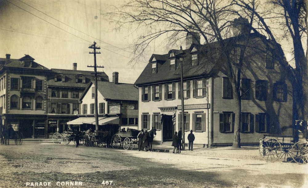 A 19th century photo of the  Newport National Bank's historic home on Washington Square. Also visible are the Ambrose Dining Rooms and Coggeshall’s Market. © Newport Historical Society. Reprinted with permission.