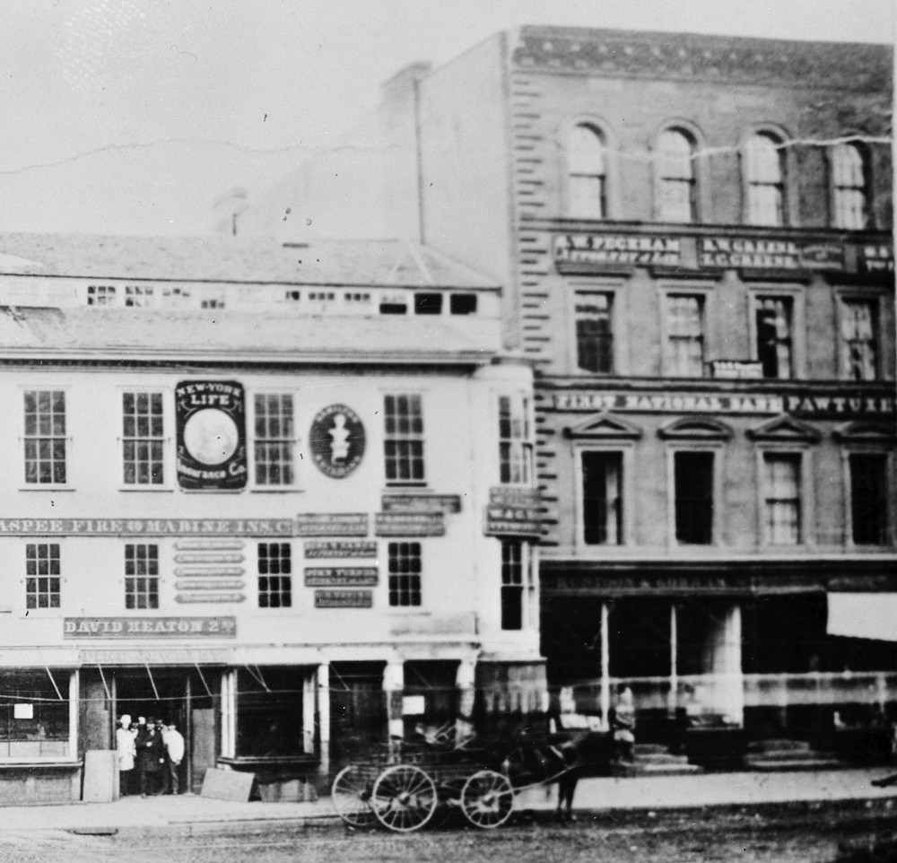 The Pawtuxet Bank's home on Westminster Street was located on the second floor of the building at right. The "Pawtuxet" of the bank's sign is visible here. 